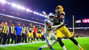 Illustration of Brian Branch punching JuJu Smith-Schuster during a post-game altercation.