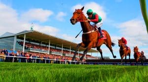 Illustration of Aworkinprogress leading the field in the Welsh Grand National Trial at Chepstow.