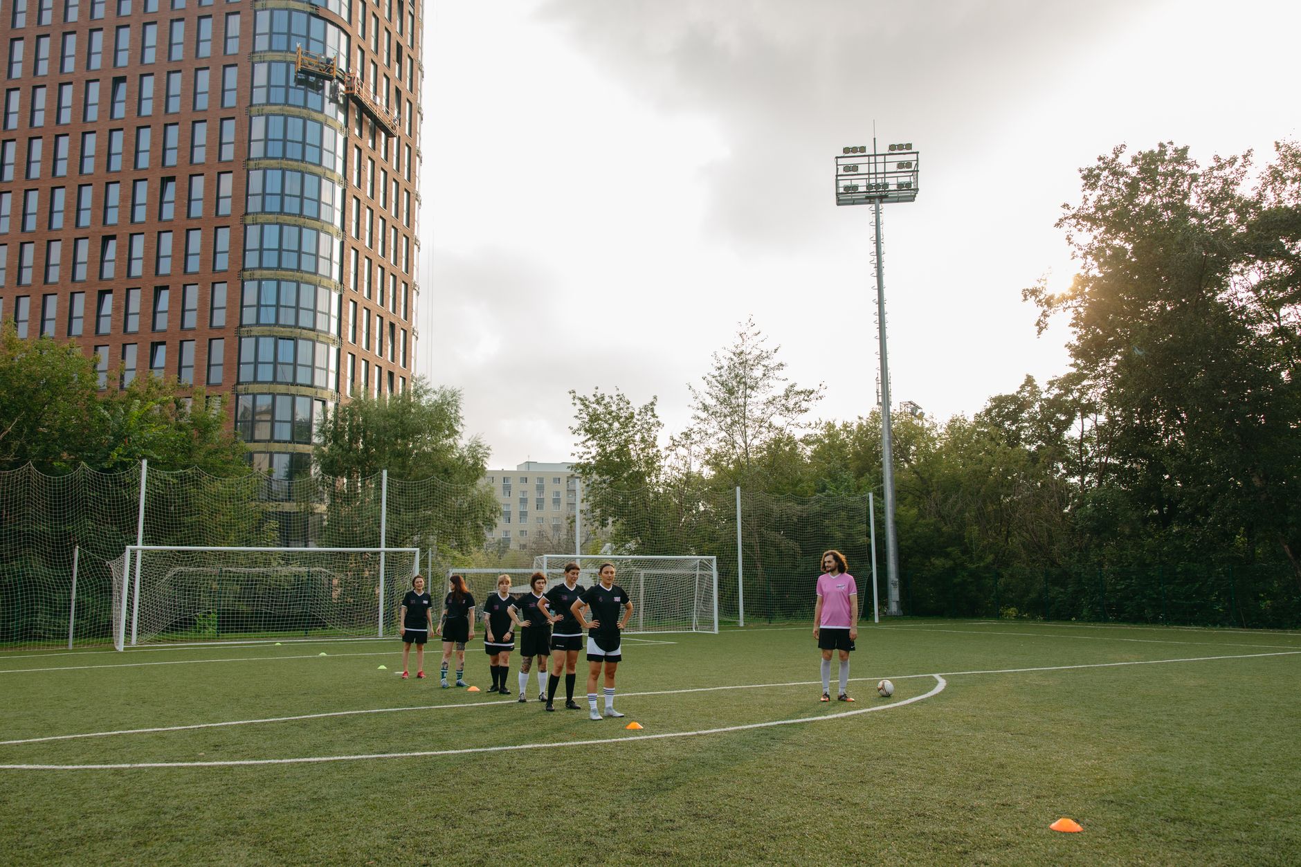 Football players and a coach during a training session